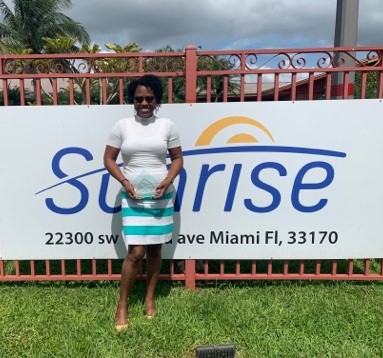 Casandre Joseph, 2021 Florida Direct Support Professional (DSP) of the Year, posing with her award